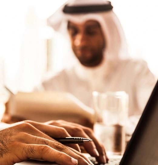 A lawyer at BR Law Firm ( Office Of Hassan Tamim Advocates ) reviewing case documents in Dubai